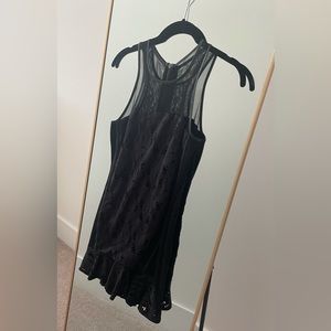 Fun black mini dress with no damage. An edgy and fun LBD from Revolve.